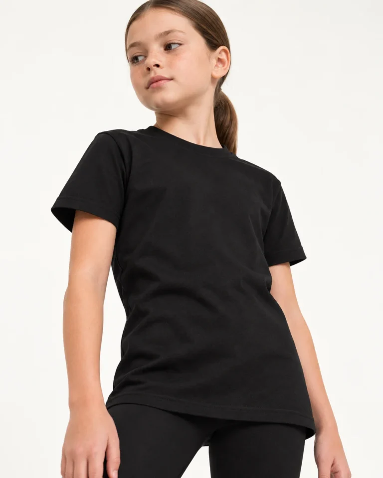 Kids Cotton T-Shirt in Black | Sportex TS | The Printwear Company ™ Kids Cotton T-Shirt in black, shown on a dancer against an off-white studio background